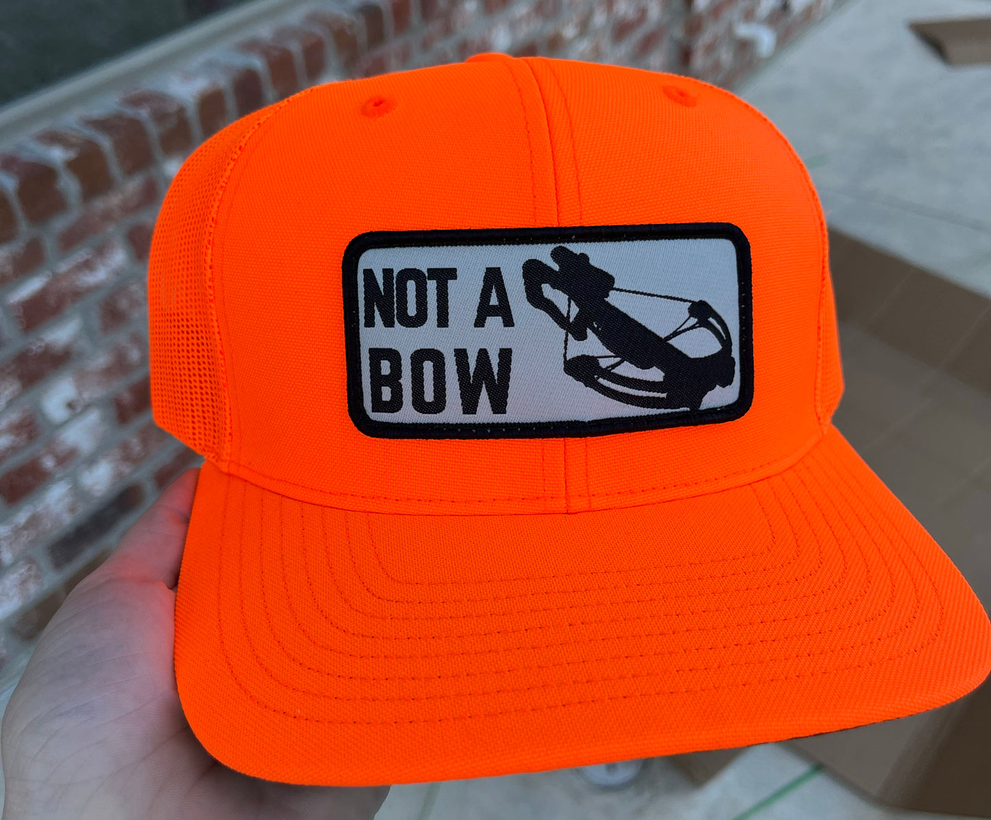 Blaze Orange 'NOT A BOW" Trucker