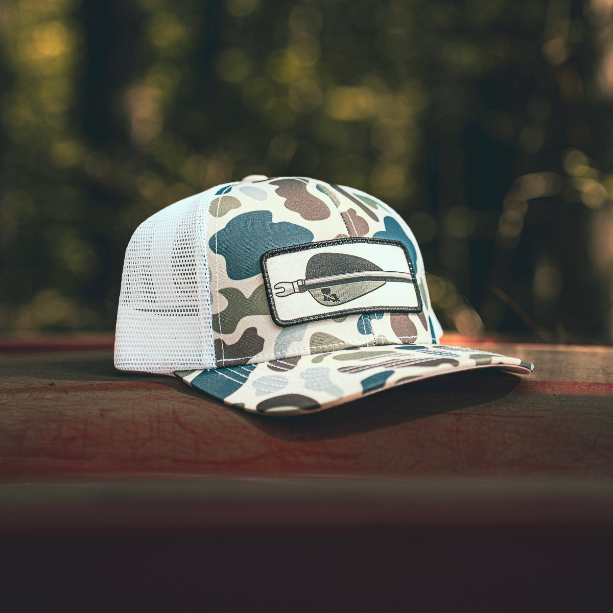 Old's Cool Camo Arrow Patch Trucker